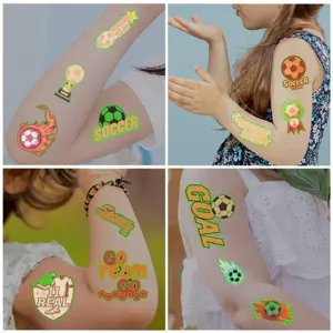 Detailed close-up showing various luminous soccer temporary tattoos applied on a child's arm