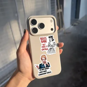 Macro detail of waterproof vintage female quote stickers on a beige smartphone case