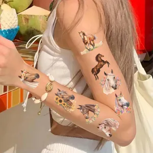 Detailed view of colorful horse temporary tattoo stickers applied on arm for kids