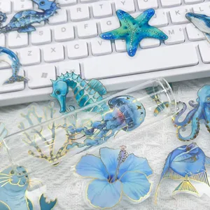 Detailed macro view of blue marine animal PET stickers with elegant gold foil stamping