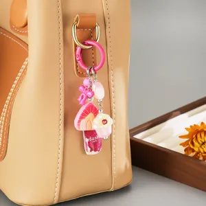 Sweet acrylic fruit ice cream bag charm with pink bow and strawberry charm detail