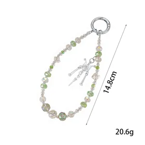 Detailed view of beaded butterfly phone charm showing 14.8cm length and 20.6g weight