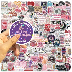 Hand holding a holographic bookish sticker from a 150-piece romantic reader theme set.
