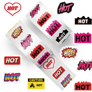 Macro view showing a variety of graphic 'HOT' themed decorative stickers on a roll.