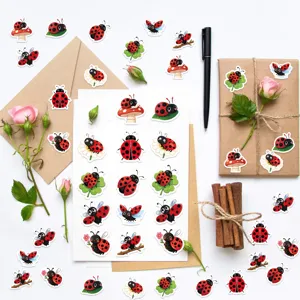 Detailed view of various cute cartoon ladybug stickers for DIY journals and gifts.
