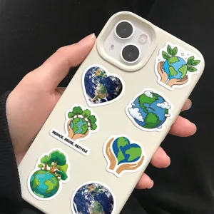 Detailed view of various eco-friendly Earth Day cartoon stickers on a beige phone case