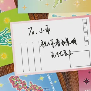 Detailed macro view of a magic plant themed greeting postcard with handwritten wishes