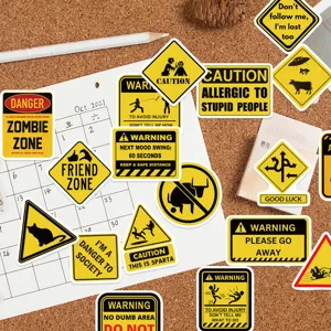 Detail shot of funny yellow warning stickers featuring various humorous slogans on a corkboard.