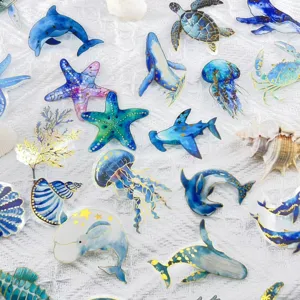 Detail of gold foil ocean creature stickers with transparent PET finish.