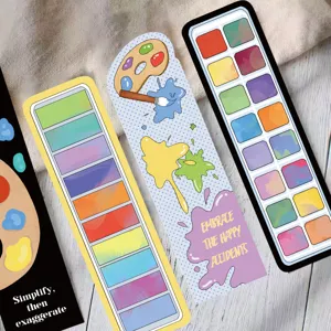 Close-up of creative artistic paper bookmarks with colorful palette and paint splatter designs