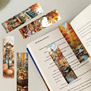 Detailed close-up showing artistic autumn oil painting bookmarks inside an open book.