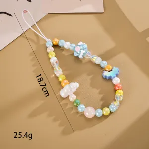 Detail showing length and weight of handmade beaded phone strap with pixel heart