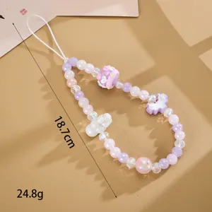 Close-up of a handmade purple and white beaded phone strap with 18.7cm length