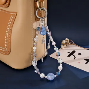 Exquisite beaded bag charm with cat's eye beads, gourd, and horse pendant detail.