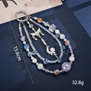 Elegant beaded phone charm with moon pendant and purple cat-eye beads, 15.6cm long.