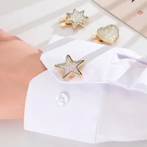 Close-up of sparkling star-shaped zinc alloy cufflink on white shirt cuff