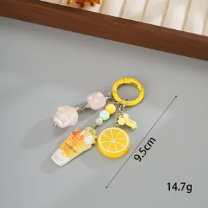 Detailed view of sweet acrylic fruit and ice cream keychain charms decoration
