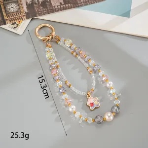 Close-up detail of double-layer beaded phone charm showing 15.3cm length and 25.3g weight.