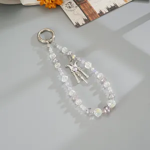 Close-up detail of iridescent beaded phone charm strap with silver butterfly pendant decoration