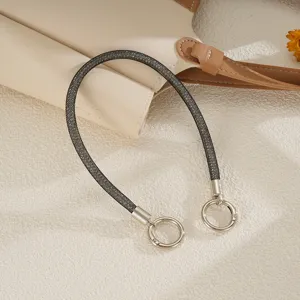 Close-up view of a luxury black sparkly mesh diamond strap with silver double ring clasps
