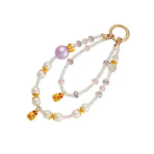 Double-strand beaded phone charm wristlet with pearls, crown charm, and faceted beads