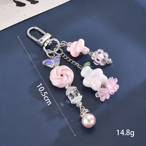 Detailansicht des rosa Blumen-Sternflaschen-Taschenanhängers mit 10,5 cm Länge und 14,8 g