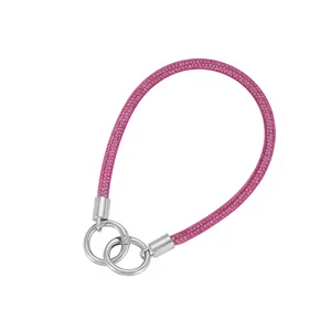Detailed view of pink mesh rope phone strap with sparkling rhinestones and silver rings