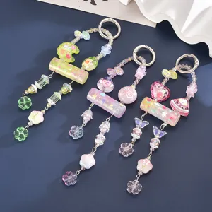 Close-up of translucent candy-colored beaded keychains with floral and heart charms