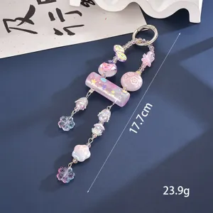 Close-up of a purple beaded keychain charm showing 17.7cm length and 23.9g weight.