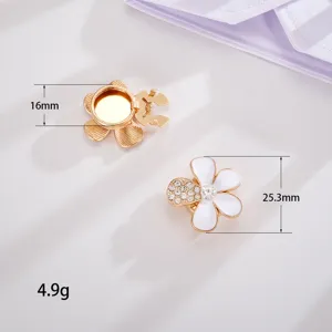 Macro detail of elegant five-petal floral shirt collar clips with rhinestone accents