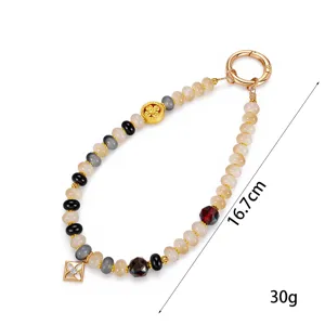 Detailed view of the handmade beaded phone charm showing 16.7cm length and 30g weight.