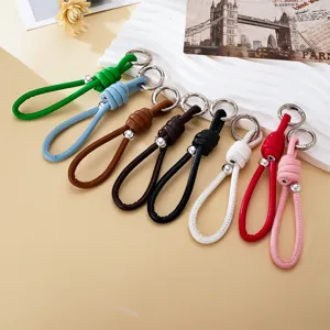 Hand-Woven Leather Rope Keychain Roman Knot Bag Charm Pendant With Metal Bead Minimalist Versatile Car Key Ring Jewelry For Women Men