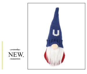 Detailed closeup view of patriotic gnome doll with knit letter U and soft white beard.
