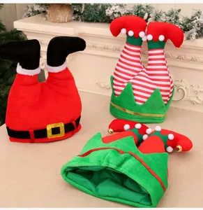 Close up detail of funny Christmas elf and Santa boots hats, festive holiday party decor.