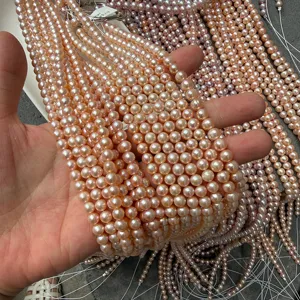 Detailweergave van glanzende 5,5-6mm roze zoetwaterparels voor DIY-sieraden