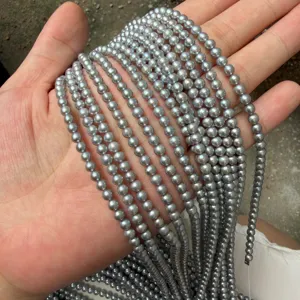 Macro view of 4mm grey freshwater pearls strands showing natural metallic luster and shine.