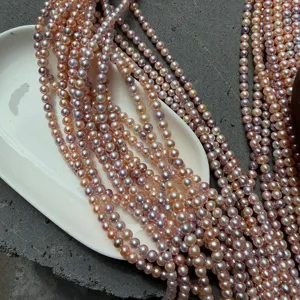 Detailopname van 5,5-6mm zoetwaterparels in snoepkleuren met hoge glans voor DIY-sieraden