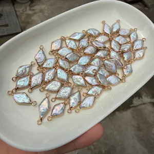 Macro view of natural rhombus baroque pearls with gold-plated double-loop edges for DIY jewelry