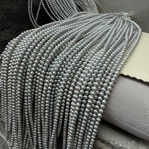 Close-up of 4mm near-round grey freshwater pearl strands for DIY jewelry making