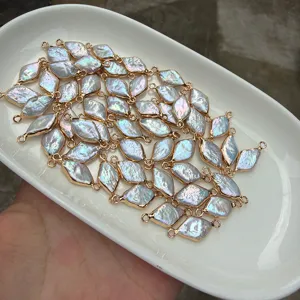 Close-up of gold-plated rhombus baroque pearl connector charms for DIY jewelry making