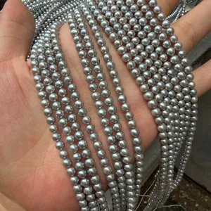 Macro view of 4mm near-round grey freshwater pearl strands used for DIY jewelry making