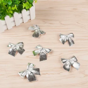 Silver Christmas bows decorations set for tree hanging and holiday party gift wrapping.