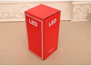 Red packaging box for LED Christmas music oil lamp, sturdy paper container, clear text.