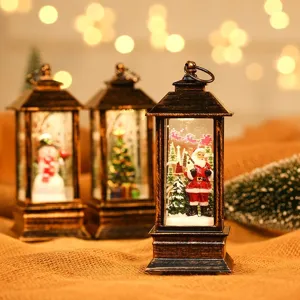 Piccola lampada a olio decorativa natalizia in resina dorata con interno Babbo Natale