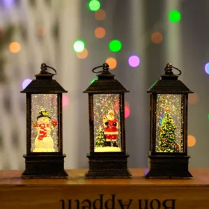 Detailed view of vintage Christmas snow globe lanterns with lighting and festive holiday scenes.