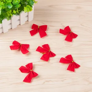 Red Christmas bows detail shot showing multiple miniature decorative bows for tree hanging.