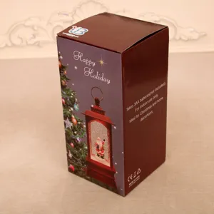 Caja de embalaje de linterna de agua navideña, luz nocturna festiva decorativa con diseño navideño.