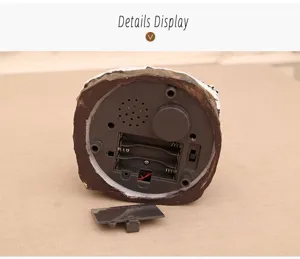 Christmas resin music box bottom detail showing battery compartment and speaker structure.