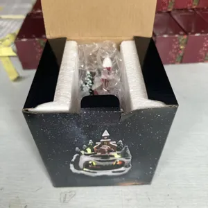 Detailed view of Christmas resin musical ornament packaging box, perfect holiday gift decor.