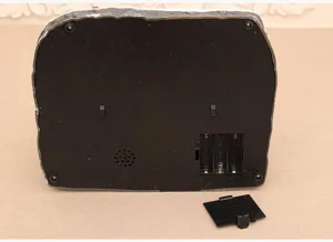 Close-up detail of the bottom showing battery compartment and speaker for Christmas decor.